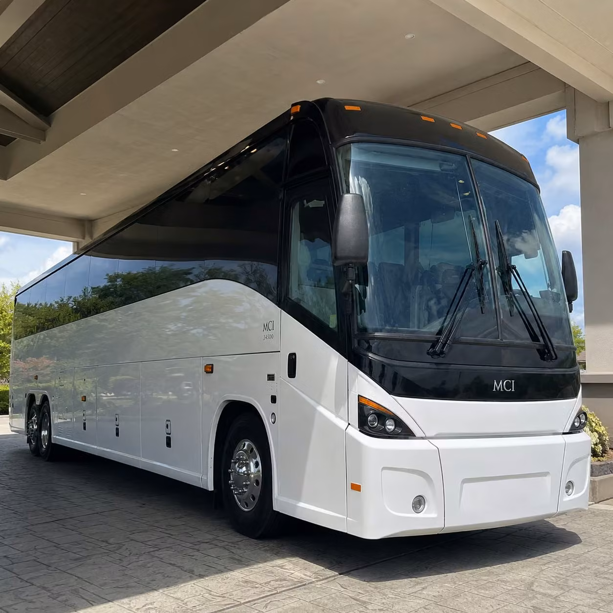 rather than splitting your team across rideshares keep everyone together on one comfortable bus
